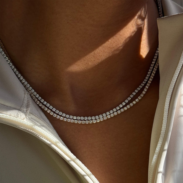 Model wearing LAB-Created Unflippable Tennis Necklace in White Gold with solid gold Stone and Strand jewelry