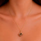 Image of 10K Yellow Gold Lady Luck Ruby Dice Charm on Models Neck