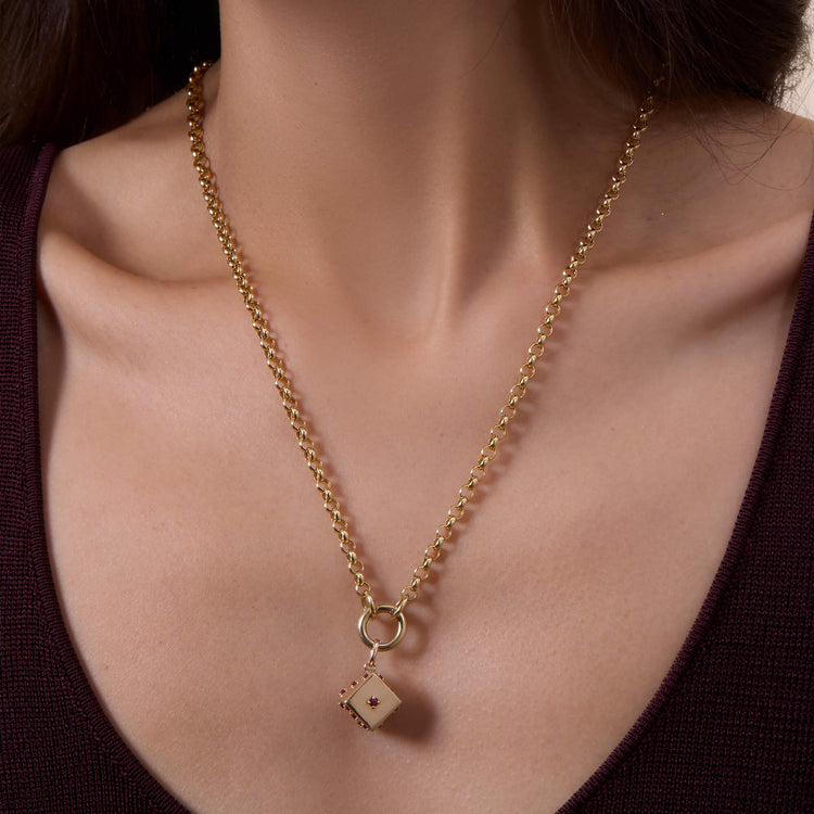 Image of 14K Yellow Gold Lady Luck Ruby Dice Charm on Models Neck