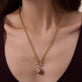 Image of 14K Yellow Gold Lady Luck Ruby Dice Charm on Models Neck