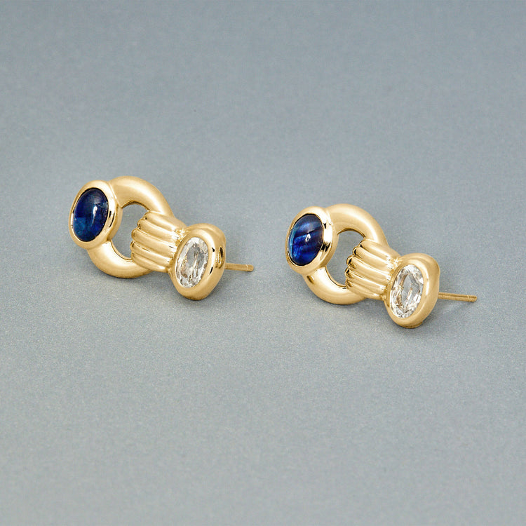 Stone and Strand 14K Yellow Gold Le Bleu Bijoux Gemstone Door Knocker Earrings Editorial Image
