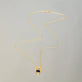 Stone and Strand 14K Yellow Gold Le Bleu Bijoux Diamond and Blue Sapphire Door Knocker Necklace Editorial Image