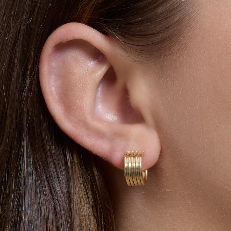 Image of 14K Yellow Gold Linear Ridge Hoops on Models Ear