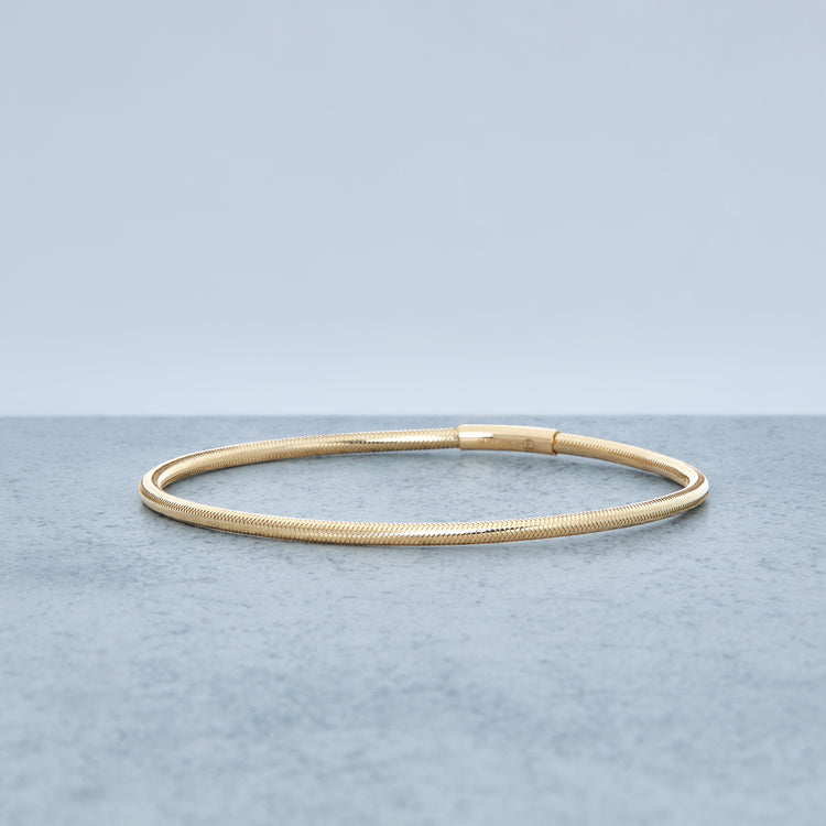 Stone and Strand 14K Yellow Gold Liquid Gold Stretch Bracelet Editorial Image