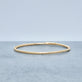 Stone and Strand 14K Yellow Gold Liquid Gold Stretch Bracelet Editorial Image