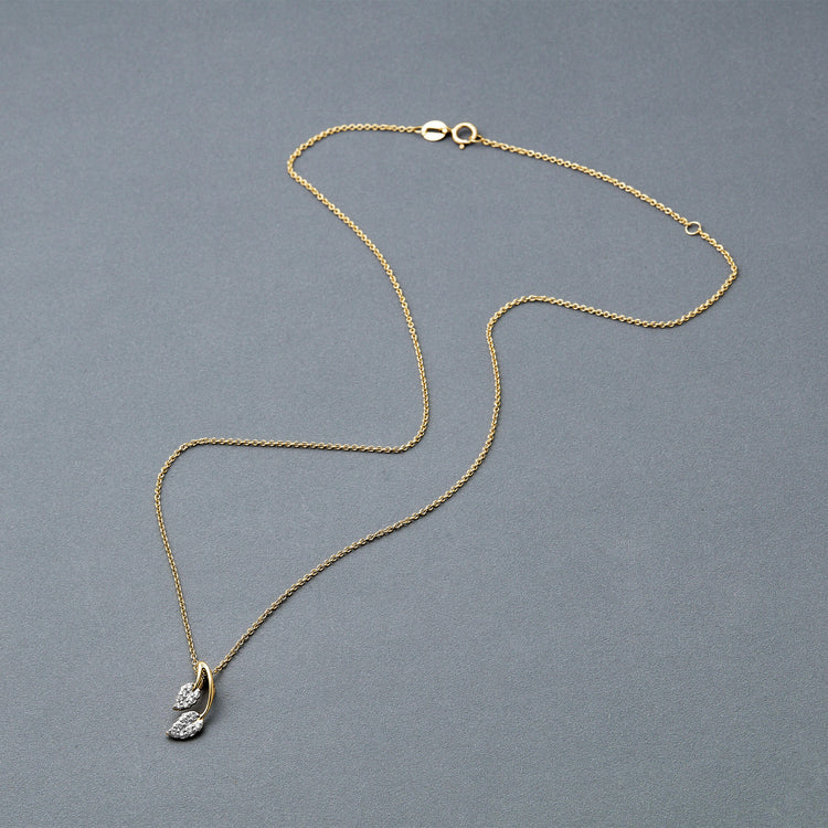 Stone and Strand 10K Yellow Gold Little Leaf Necklace Editorial Image