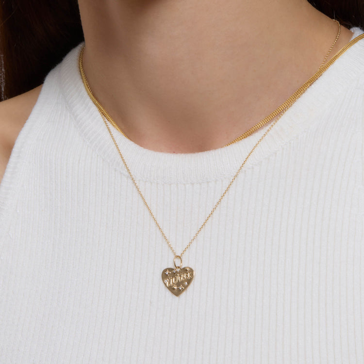 Image of 14K Yellow Gold Love New York Diamond Necklace on Models Neck