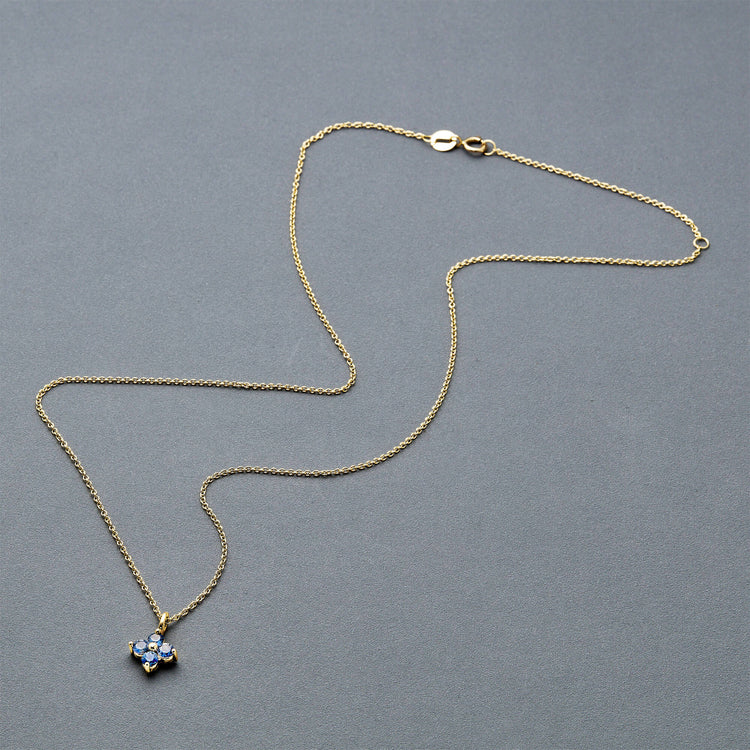 Stone and Strand 10K Yellow Gold Luckiest Clover Blue Sapphire Necklace Editorial Image