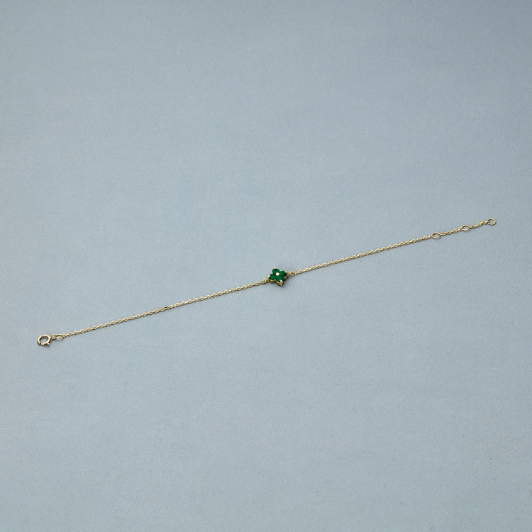 Stone and Strand 10K Yellow Gold Luckiest Clover Emerald Bracelet Editorial Image