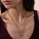 Image of 14K Yellow Gold Lucky Clover Emerald Charm on Models Neck
