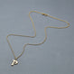 Stone and Strand 14K Yellow Gold Marais Gold Initial Necklace Editorial Image