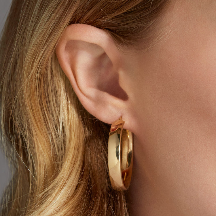 Image of 10K Yellow Gold Large Gold Glider Hoops on Models Ear