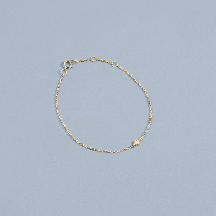Stone and Strand 10K Yellow Gold Tiny Round Diamond Bracelet Editorial Image