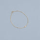 Stone and Strand 10K Yellow Gold Tiny Round Diamond Bracelet Editorial Image
