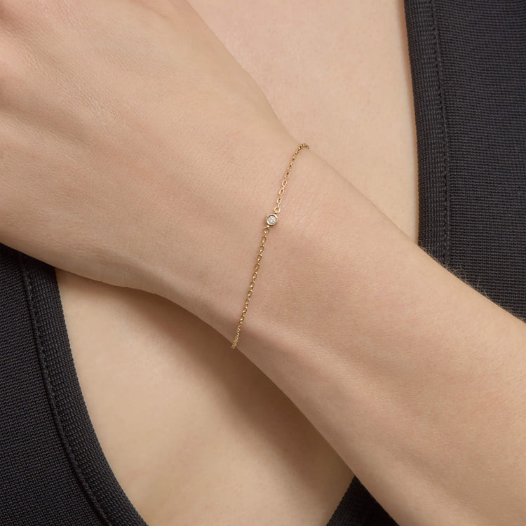 Image of 10K Yellow Gold Medium Round Diamond Bracelet on Models Arm