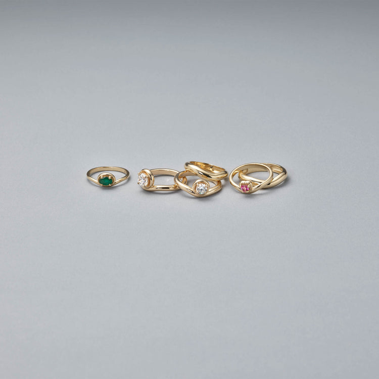 Still life image of Bold Merge Ring with Stone and Strand solid gold jewelry