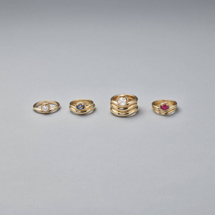 Still life image of Bold Merge Ring with Stone and Strand solid gold jewelry