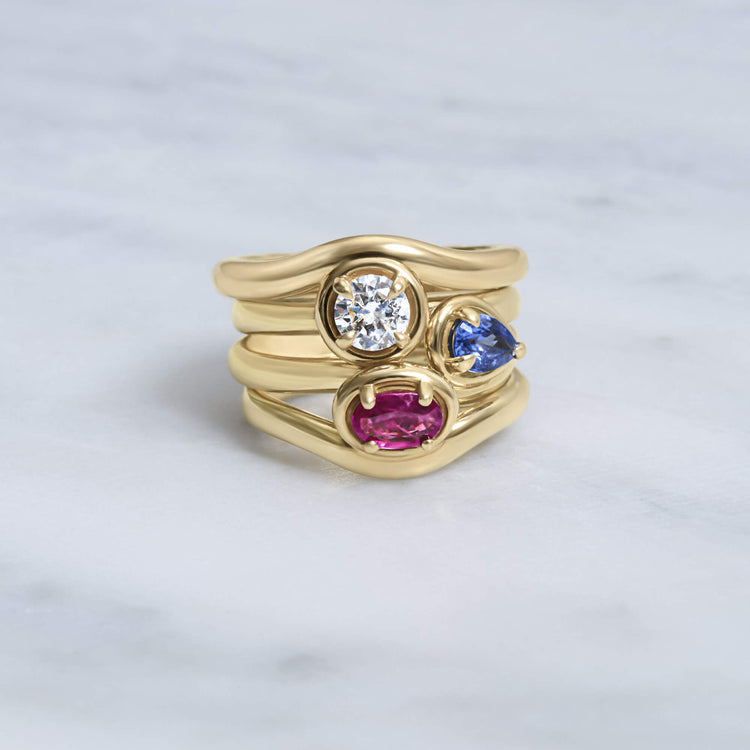 Still life image of Sapphire Raindrop Merge Ring with Stone and Strand solid gold jewelry