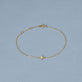 Stone and Strand 14K Yellow Gold Mini Clover Diamond Bracelet Editorial Image