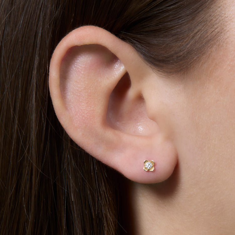 Image of 14K Yellow Gold Mini Clover Diamond Studs on Models Ear