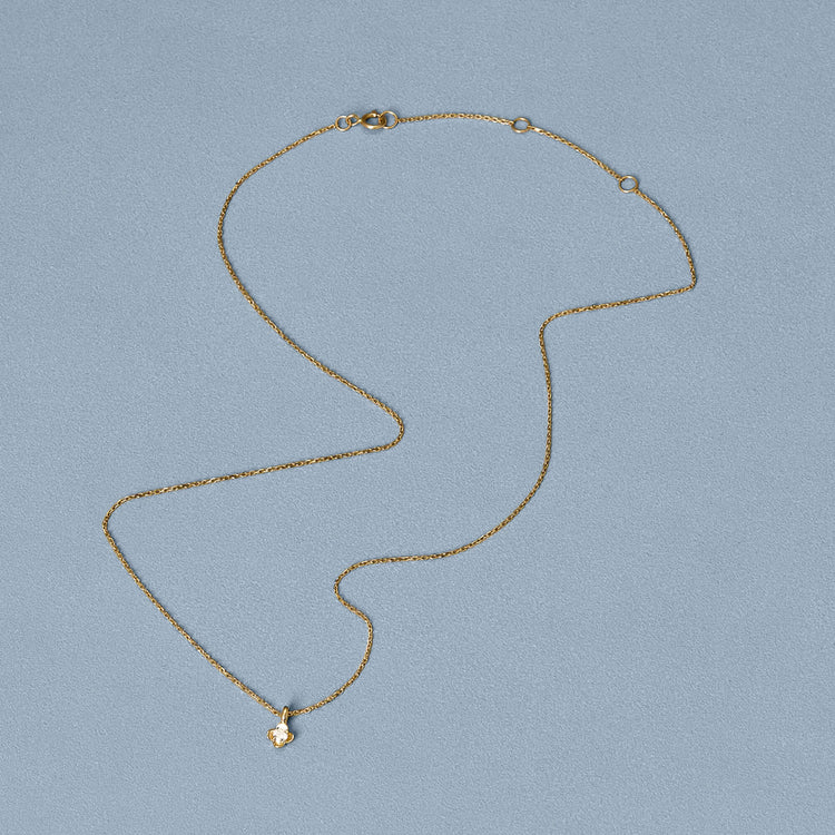 Stone and Strand 14K Yellow Gold Mini Diamond Clover Choker Necklace Editorial Image