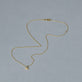 Stone and Strand 14K Yellow Gold Mini Evil Eye Welding Choker Editorial Image