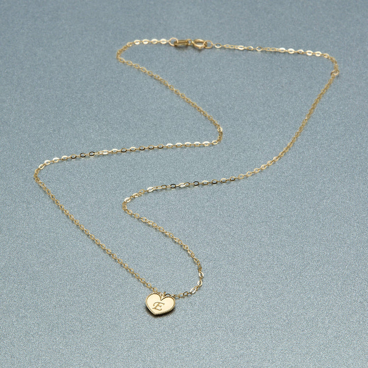 Stone and Strand 10K Yellow Gold Mini Heart Medallion Necklace Editorial Image