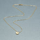 Stone and Strand 10K Yellow Gold Mini Heart Medallion Necklace Editorial Image