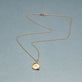 Stone and Strand 10K Yellow Gold Mirror, Mirror Initial Necklace Editorial Image