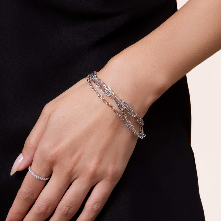Model wearing Mixed Link Silver Pivot Chain with solid gold Stone and Strand jewelry