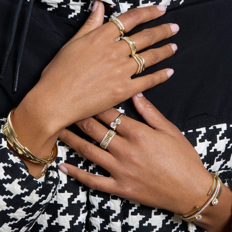 Model wearing Bold Sparkle Bracelet with solid gold Stone and Strand jewelry