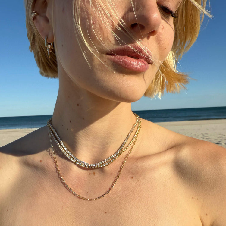 Model wearing Chubby Pave Hinged Ear Cuff with solid gold Stone and Strand jewelry