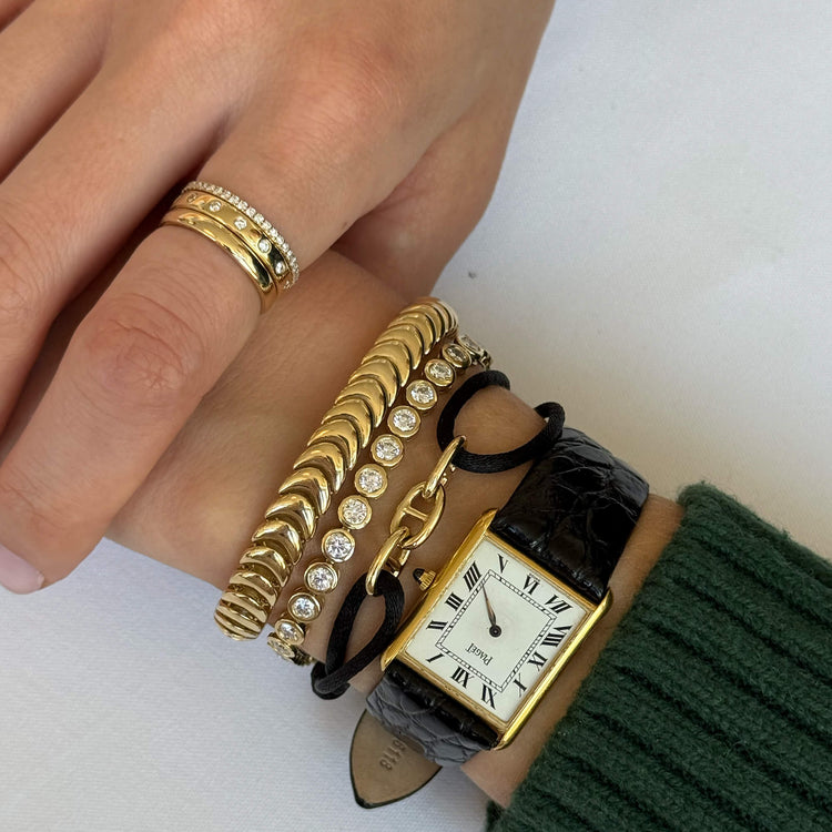 Model wearing Classic Diamond Eternity Band with solid gold Stone and Strand jewelry