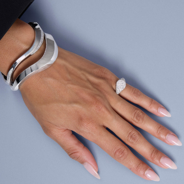 Model wearing Contour Knife Edge Stacking Bangle with solid gold Stone and Strand jewelry