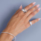 Model wearing Contour Silver Knife Edge Ring with solid gold Stone and Strand jewelry