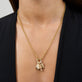 Model wearing Cream Cheese Brunch Charm with solid gold Stone and Strand jewelry