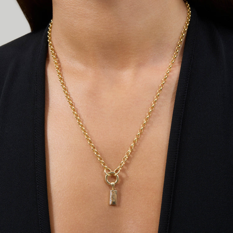 Model wearing Cream Cheese Brunch Charm with solid gold Stone and Strand jewelry