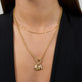 Model wearing Diamond Baguette Charm with solid gold Stone and Strand jewelry