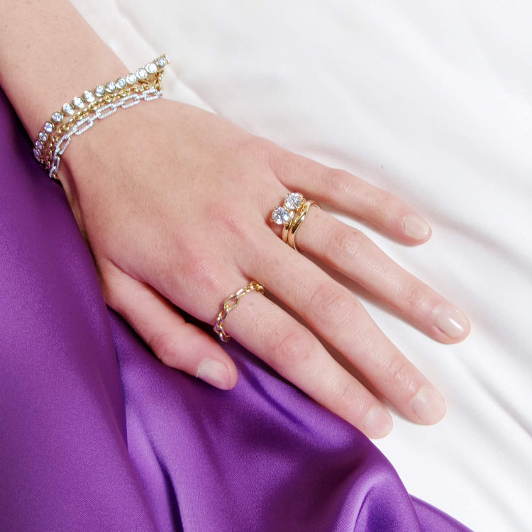 Model wearing Elongated Cable Link Ring with solid gold Stone and Strand jewelry