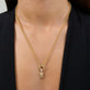 Model wearing Gold Coffee Brunch Charm with solid gold Stone and Strand jewelry