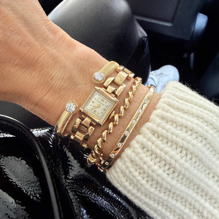 Model wearing Gold Portofino Bracelet with solid gold Stone and Strand jewelry