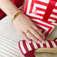 Model wearing Je Ne Regrette Gold Bangle with solid gold Stone and Strand jewelry