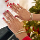Model wearing Je Ne Regrette Gold Bangle with solid gold Stone and Strand jewelry