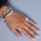 Model wearing LAB-Created Contour Knife Edge Stacking Bangle with solid gold Stone and Strand jewelry