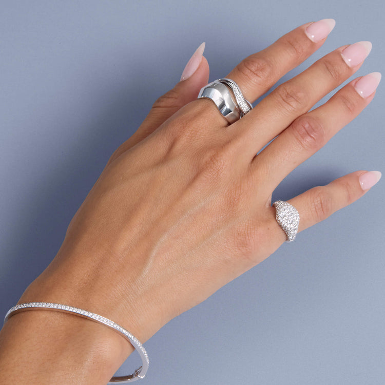 Model wearing Sterling Silver LAB-Created Contour Knife Edge Ring with solid gold Stone and Strand jewelry