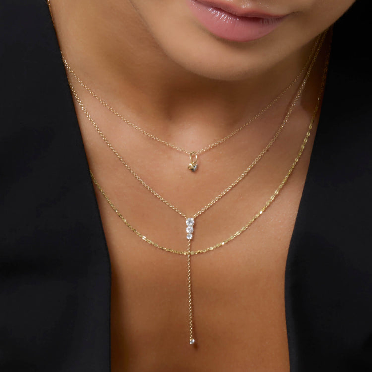 Model wearing LAB-Created Diamond Lariat Necklace with solid gold Stone and Strand jewelry