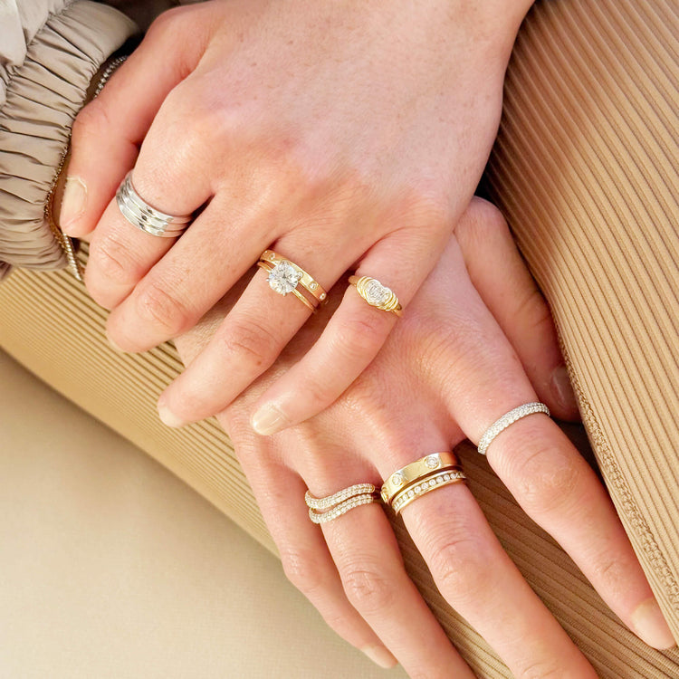 Model wearing LAB-Created Pave Silver Knife Edge Stacking Ring with solid gold Stone and Strand jewelry