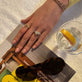 Model wearing Nantucket Knot Ring with solid gold Stone and Strand jewelry