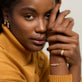 Model wearing Rossellini Bracelet with solid gold Stone and Strand jewelry