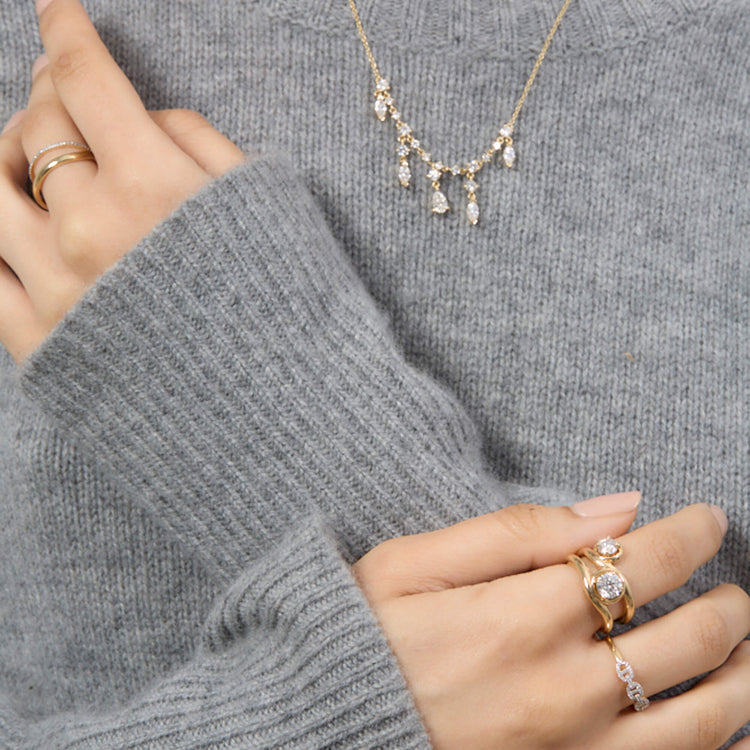 Model wearing White Diamond Pave Eternity Band with solid gold Stone and Strand jewelry